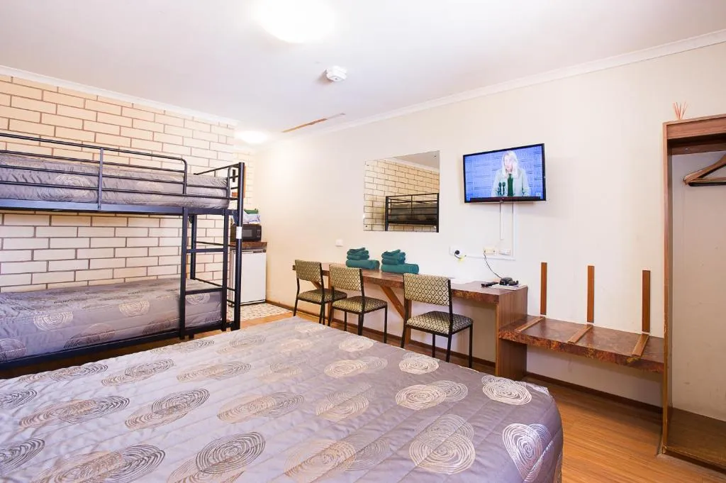 Standard Family Room - queen bed with painting above